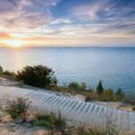 https://www.istockphoto.com/photo/sunset-over-lake-michigan-and-sleeping-bear-dunes-gm813372434-131562483?searchscope=image%2Cfilm